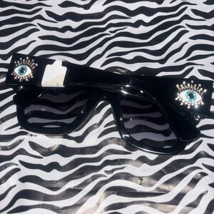 Kurt Geiger Black Sunglasses with Eye Details